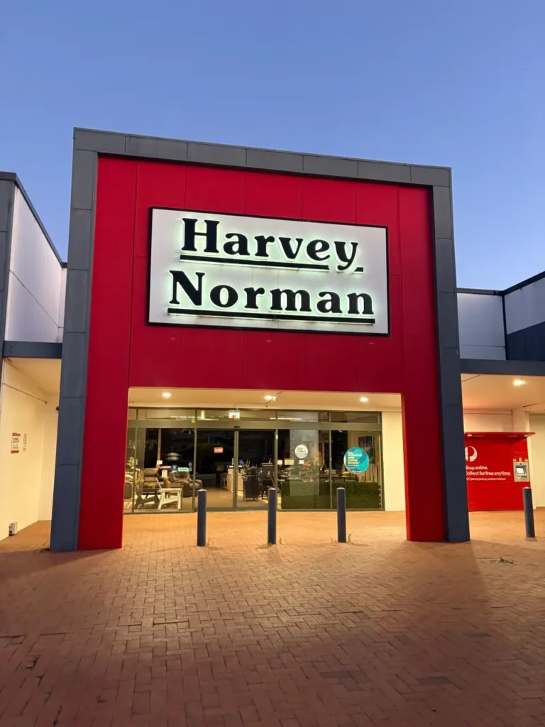 Harvey Norman retail store exterior with illuminated signage and main entrance